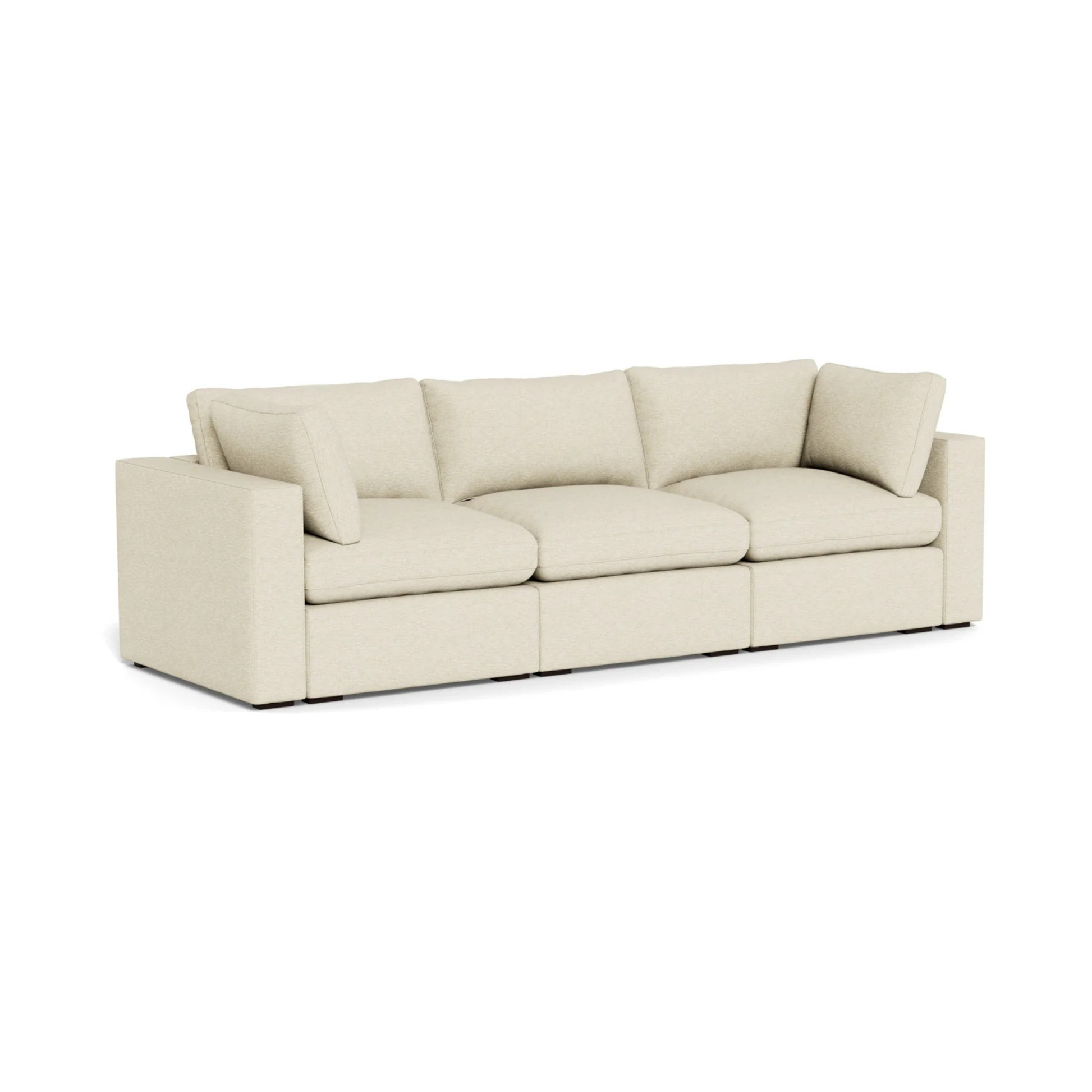 modern three seater sofa with deep cushions and clean lines
