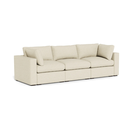 modern three seater sofa with deep cushions and clean lines
