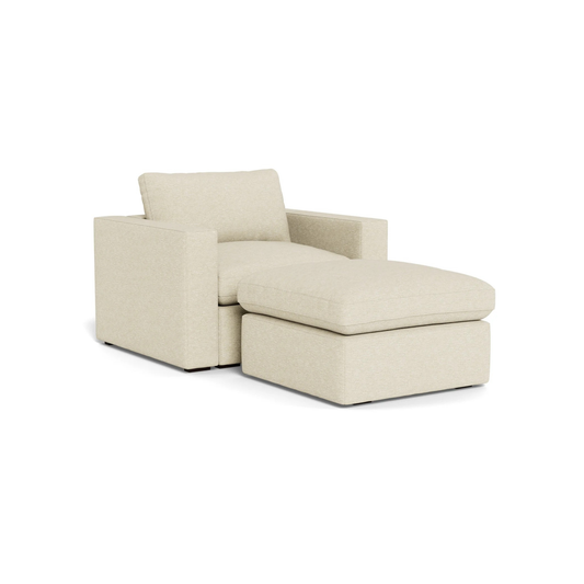 single seat sofa with footstool for compact relaxation

