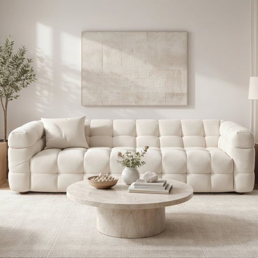 A sculptural, contemporary three-seater in soft boucle, defined by deep channel tufting and a refined low-profile silhouette, ready for quick delivery.