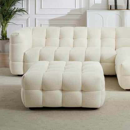 A sculptural, low-profile accent in soft boucle, featuring deep channel tufting and a refined modular design.