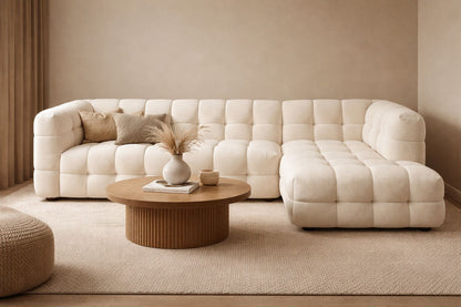 A refined, sculptural centrepiece in soft bouclé, designed with deep channel tufting and a seamless contemporary silhouette.