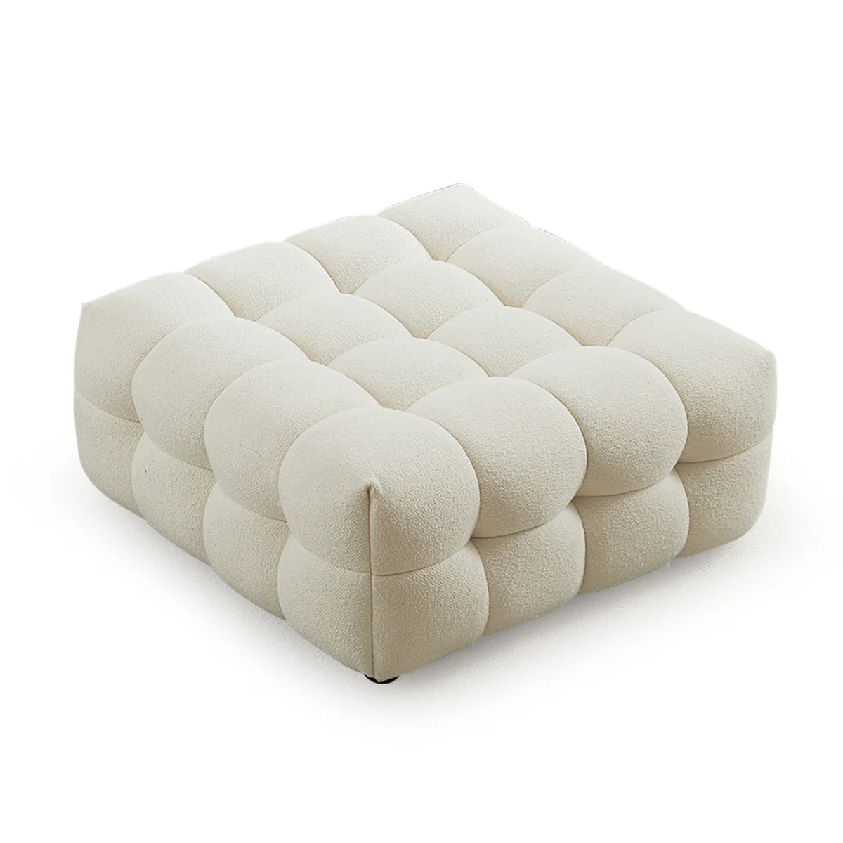 A sculptural, low-profile accent in soft boucle, designed with deep channel detailing to complement the Kyla modular range.