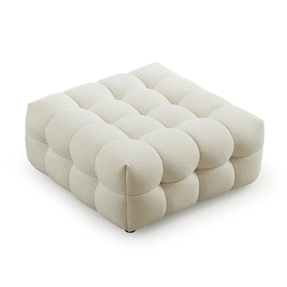 A sculptural, low-profile accent in soft boucle, designed with deep channel detailing to complement the Kyla modular range.