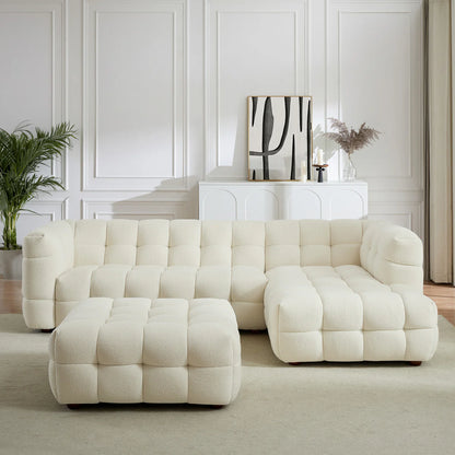 A sculptural, low-profile piece in soft boucle, featuring deep channel tufting and a versatile modular design for added comfort and style.