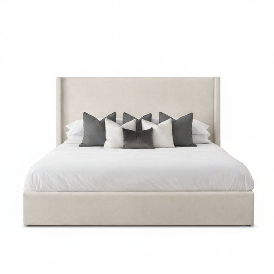 luma bed with padded upholstered headboard and soft neutral fabric base