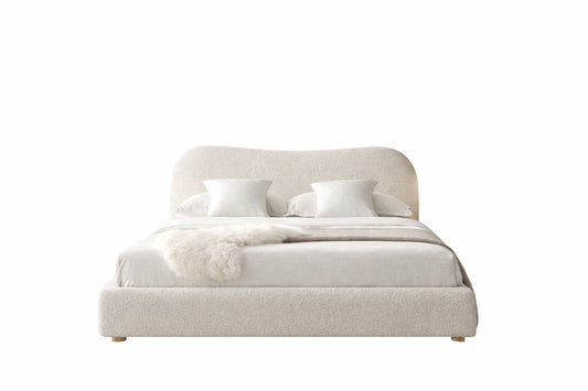  luno upholstered bed with curved headboard and soft neutral fabric finish
