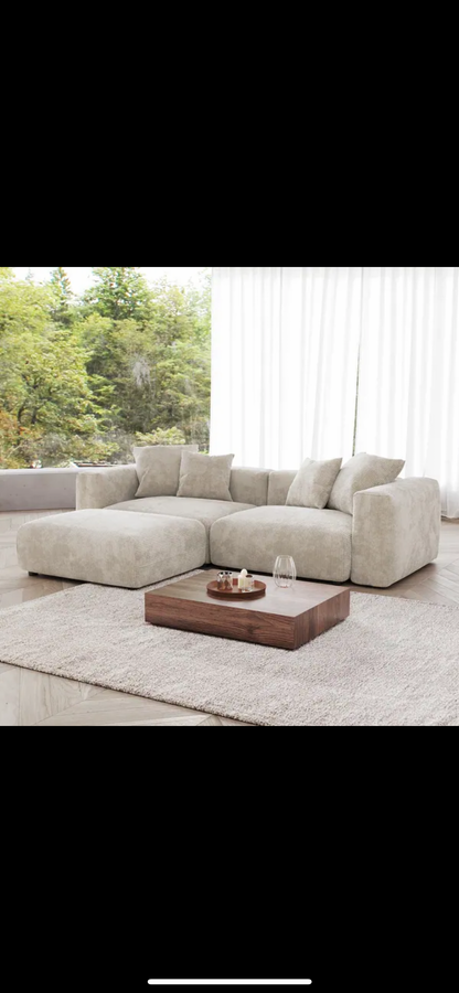 compact modular sofa set with footstool featuring deep cushions and modern clean lines
