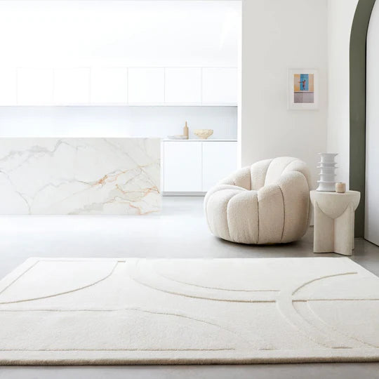 A detailed macro shot showcasing the premium 100% New Zealand wool fibres, emphasizing softness, natural texture, and subtle surface variation on a white background.