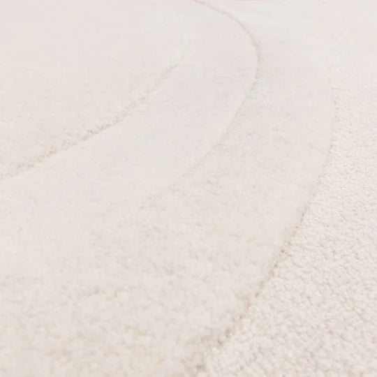 A detailed macro shot showcasing the premium 100% New Zealand wool fibres, emphasizing softness, natural texture, and subtle surface variation on a white background.