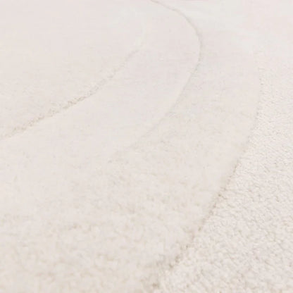 A detailed macro shot showcasing the premium 100% New Zealand wool fibres, emphasizing softness, natural texture, and subtle surface variation on a white background.