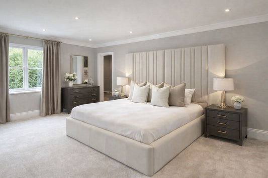 contemporary bed with vertical headboard panels and neutral fabric finish