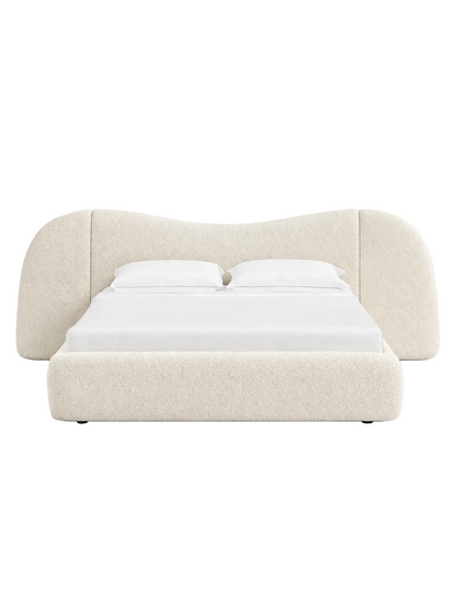 Soft curved headboard with a clean, low-profile luxury frame
