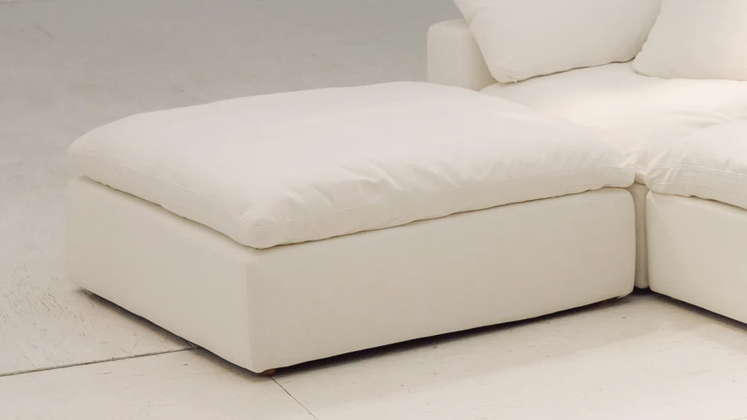 footstool designed to integrate with modular sofa sections for added comfort and versatility