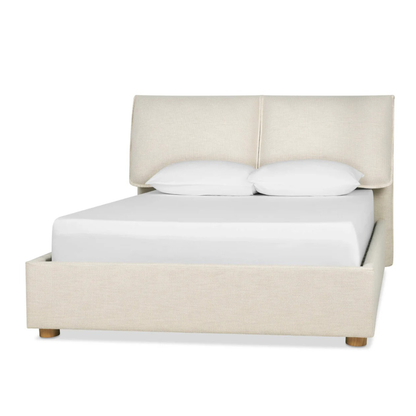 luxury upholstered bed with soft tones and modern bedroom styling