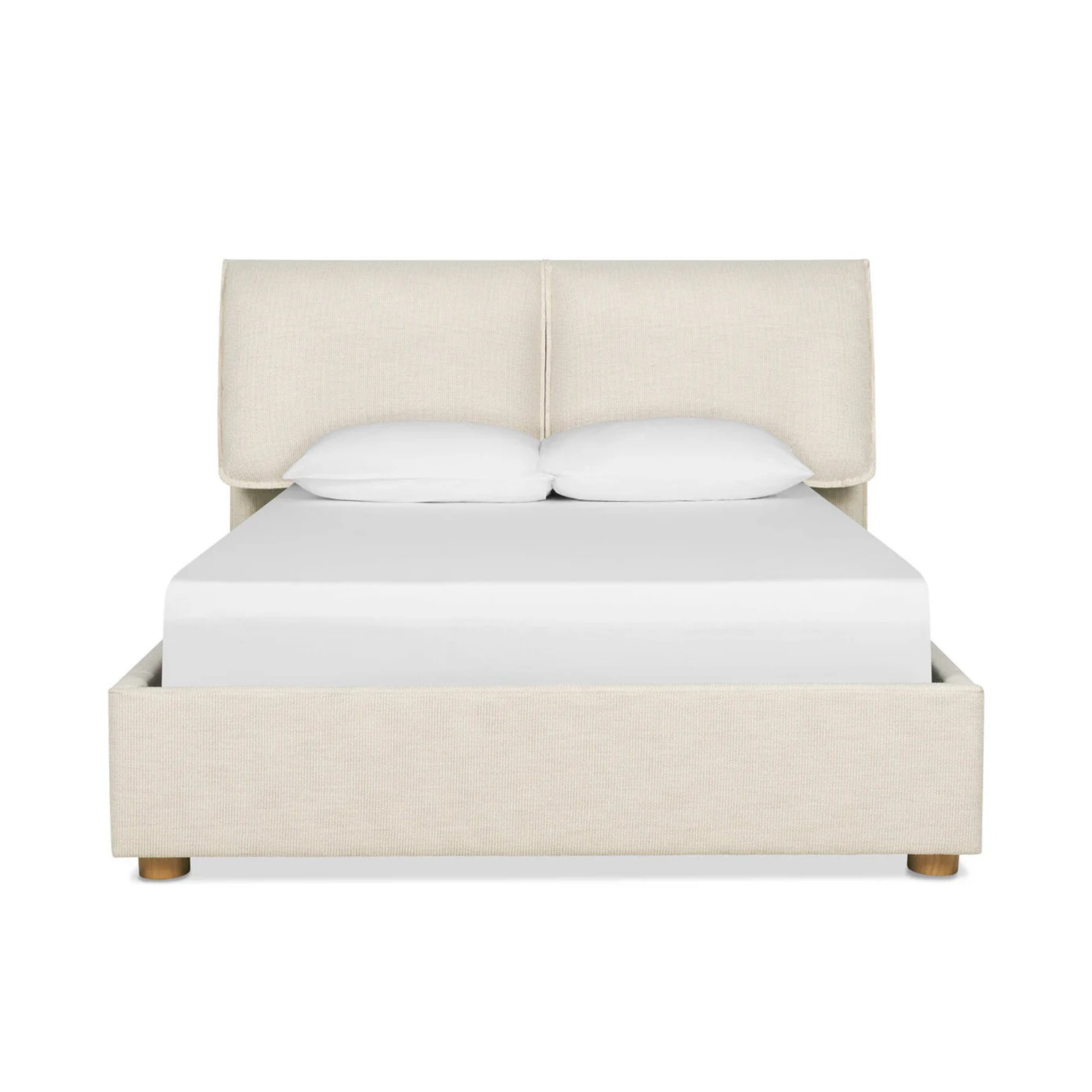 nomad bed with upholstered headboard and soft neutral fabric