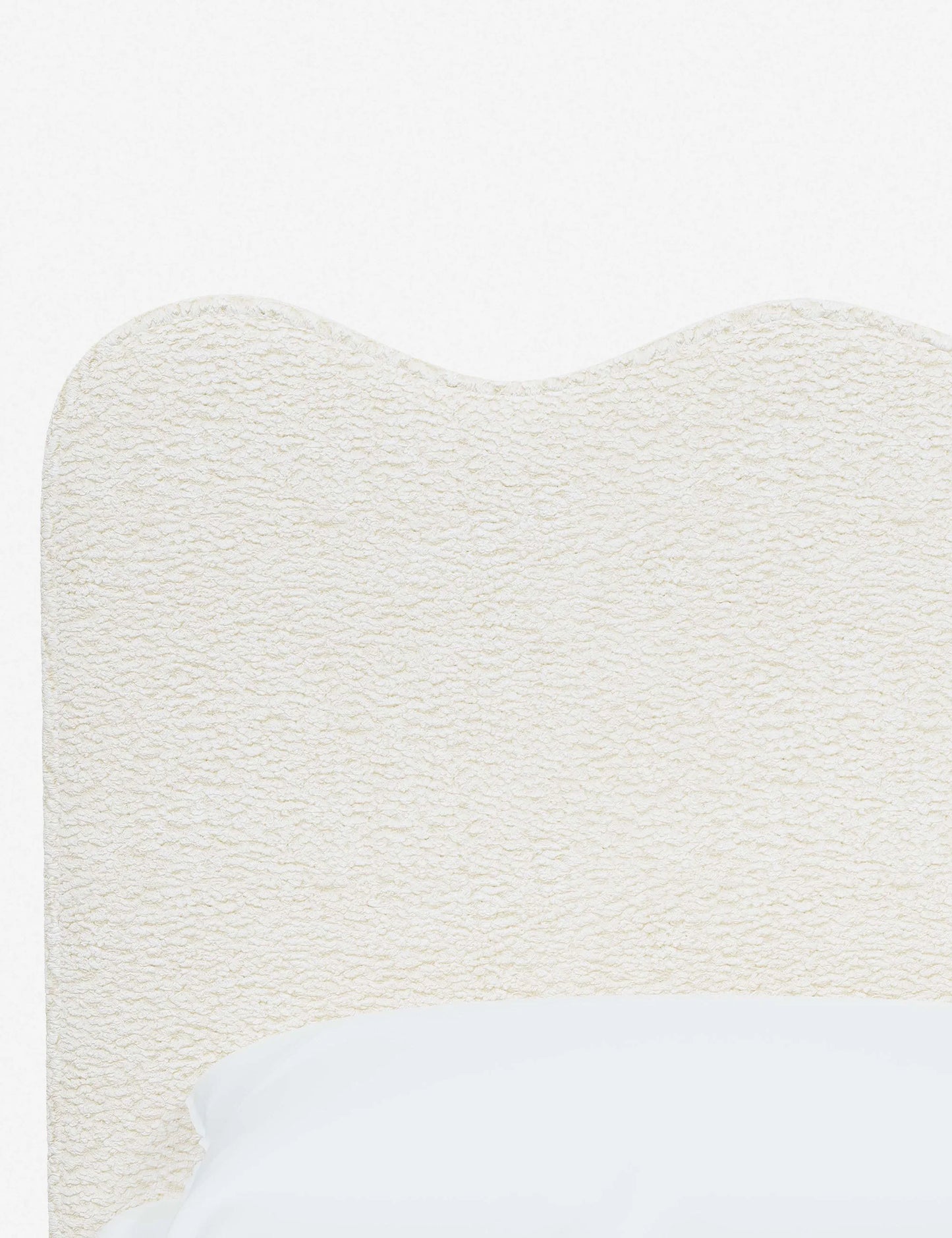 elegant upholstered bed with neutral tones and sleek design