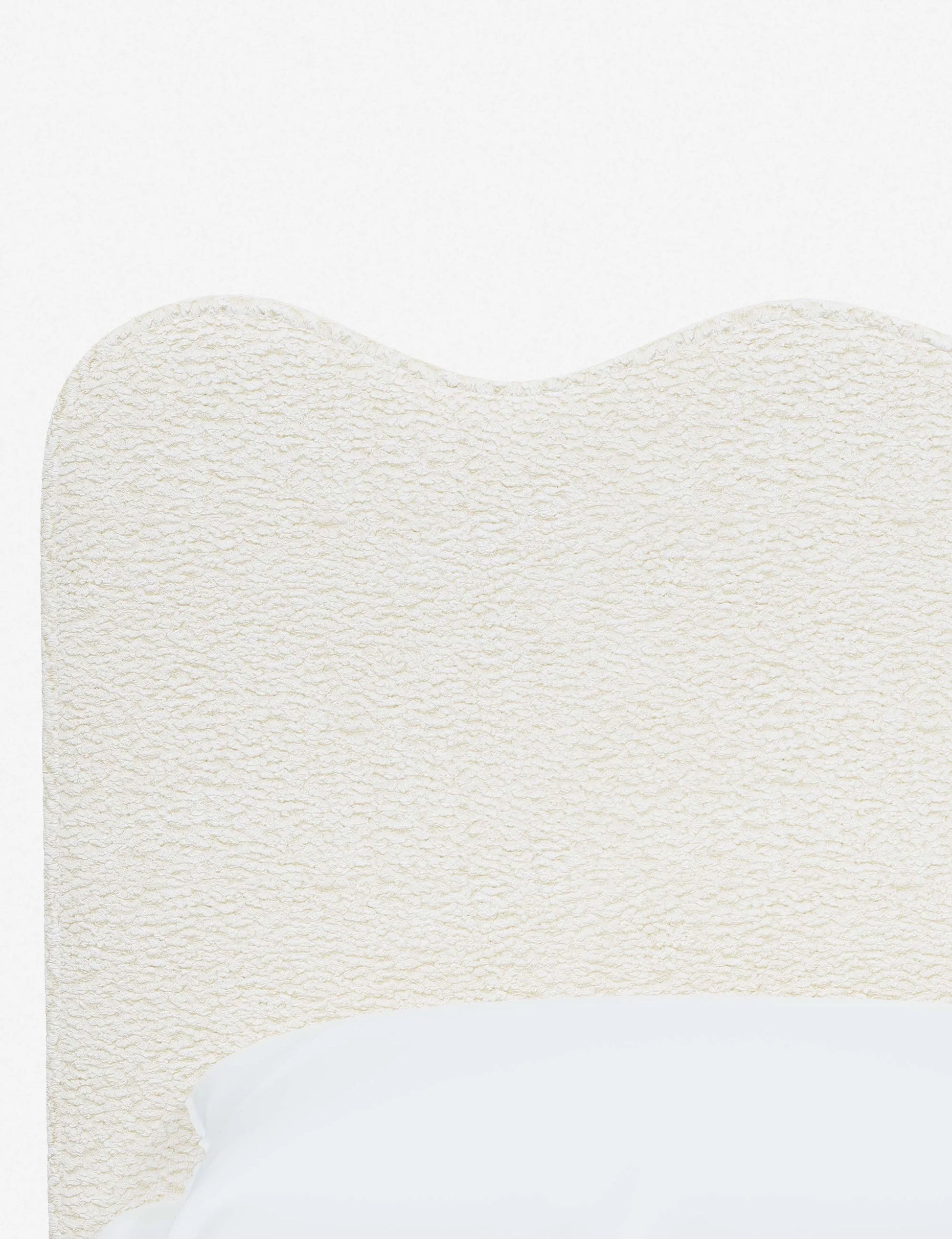 elegant upholstered bed with neutral tones and sleek design