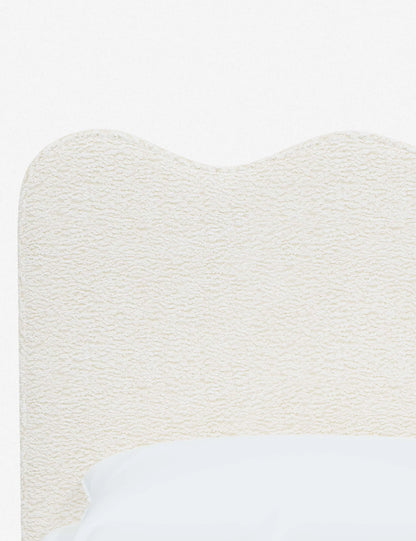 elegant upholstered bed with neutral tones and sleek design