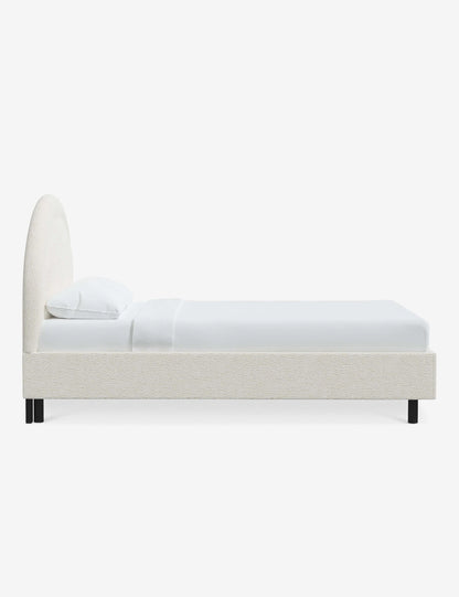 contemporary bed with bold headboard and neutral fabric