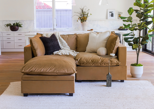 Modern Poka modular 2 seater sofa with matching footstool in living room setting
