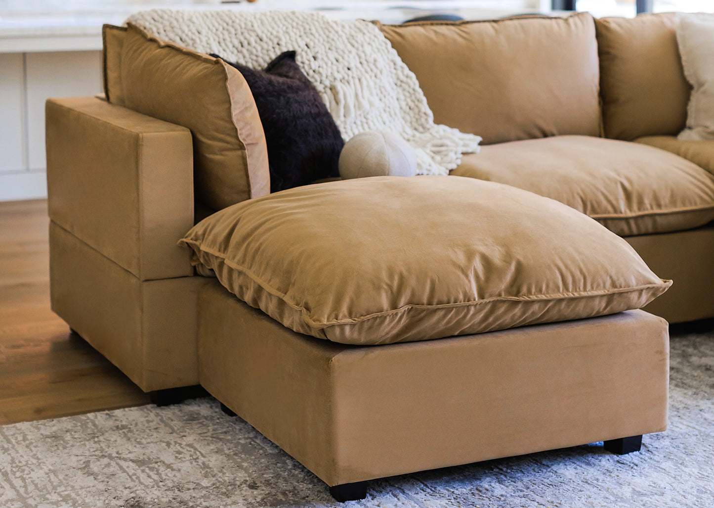 Deep, plush cushions provide a soft yet supportive seating experience, while the matching stool offers added flexibility—ideal for stretching out, additional seating, or casual lounging.
