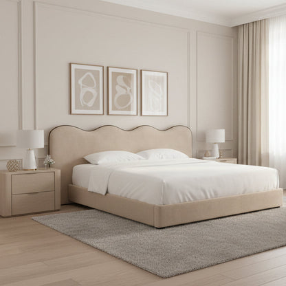  Soft neutral bed featuring curved panel design with contrasting black trim