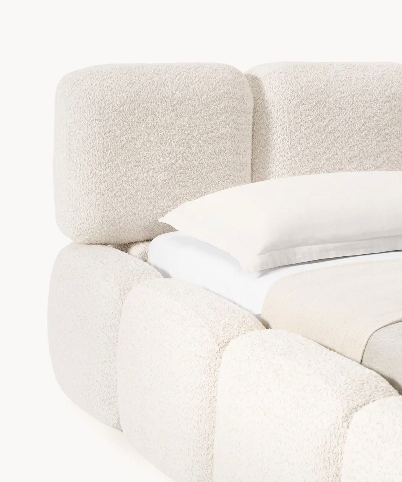  Bold upholstered design with rounded block detailing and soft architectural presence