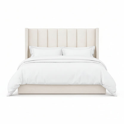 Selvara bed with tall vertically panelled upholstered headboard in a modern bedroom style
