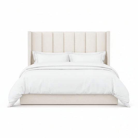Selvara bed with tall vertically panelled upholstered headboard in a modern bedroom style

