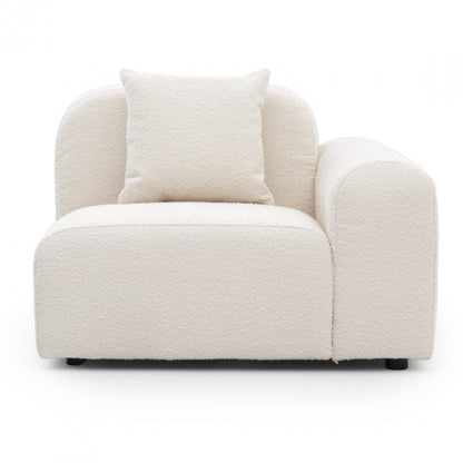 single arm modular sofa unit with soft upholstery and sleek low-profile silhouette
