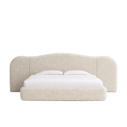 Modern upholstered bed frame with curved wraparound headboard and soft neutral fabric finish
