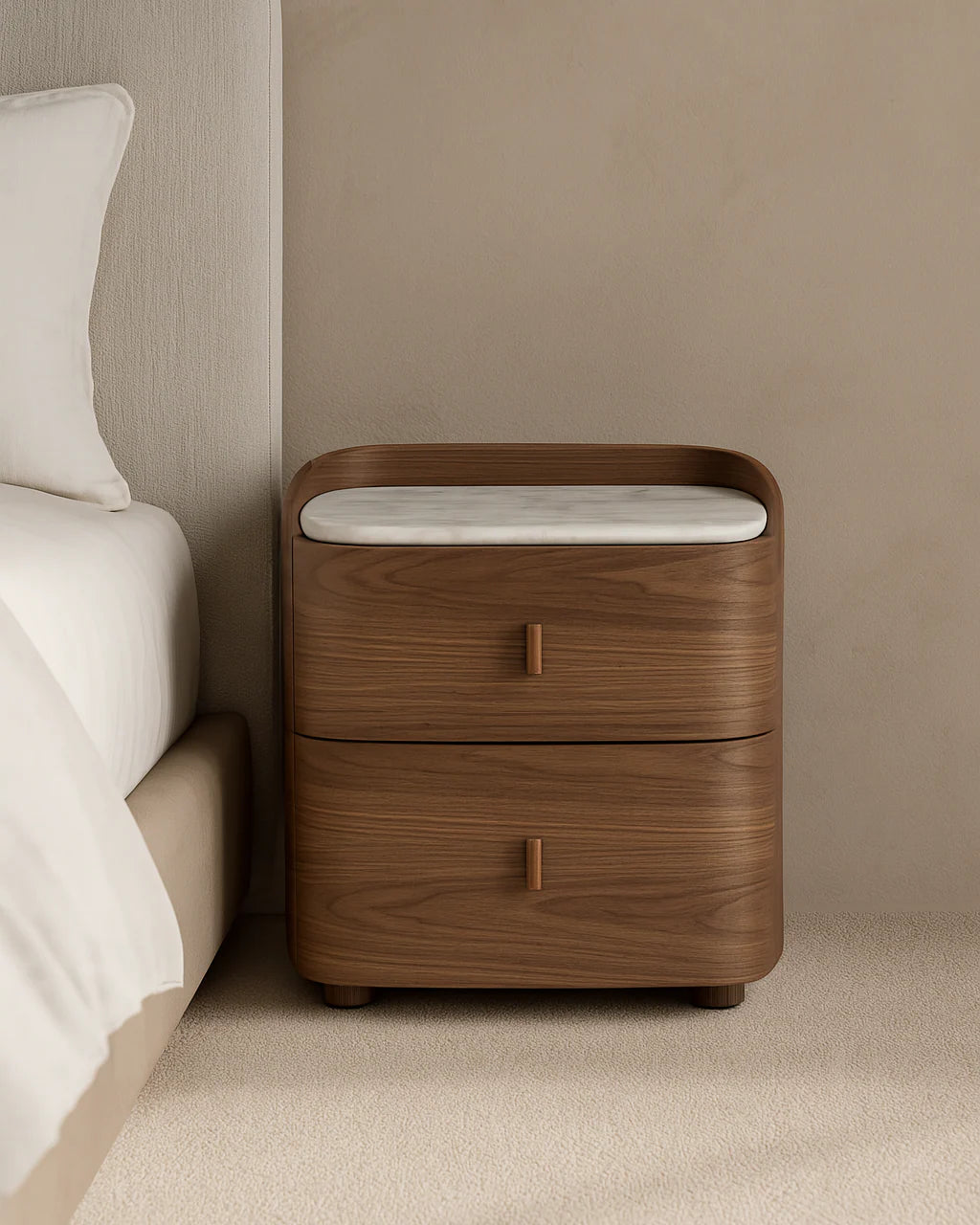 The Weston Bedside Table is displayed in a clean studio setting on a white background, showcasing its curved walnut veneer body and elegant Bianco Carrara marble top.