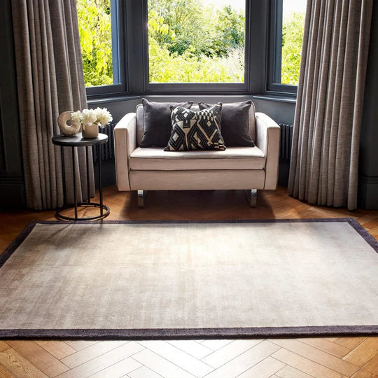An angled detail shot focusing on the rug’s edge finishing and border alignment, showcasing precision craftsmanship and durability against a clean white background.