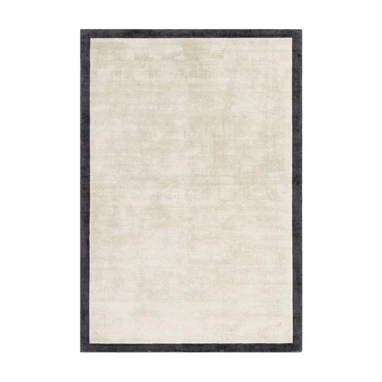 Beige rug with a black border on a white background