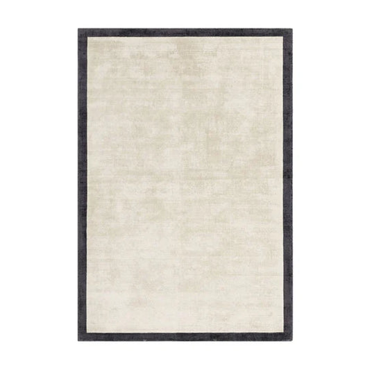 Beige rug with a black border on a white background