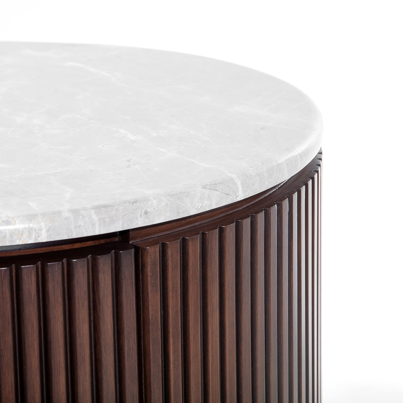 A detailed close-up showcasing the pebble grey marble surface, emphasizing natural veining, tonal variation, and a softly honed finish.
