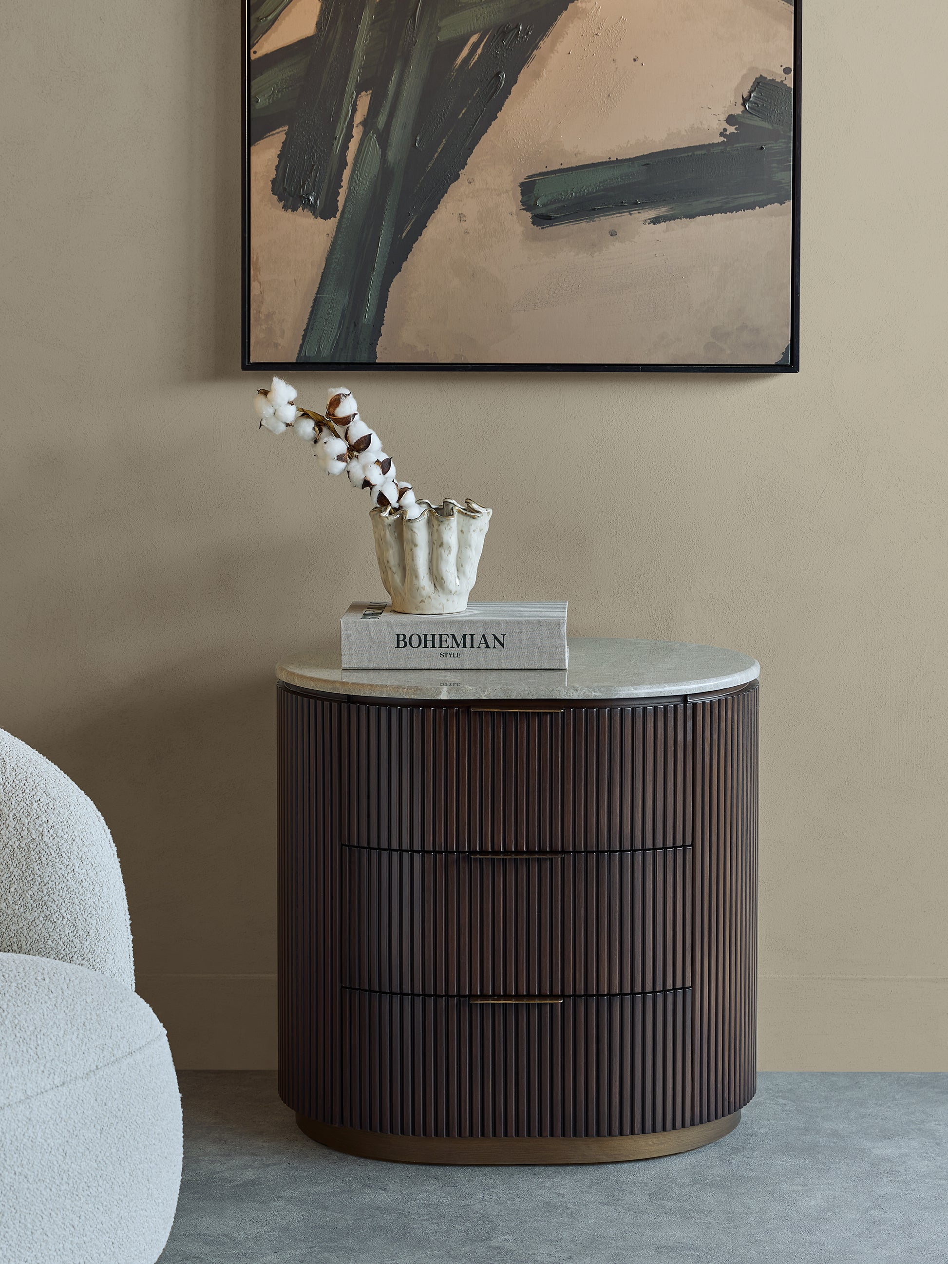A studio-style presentation emphasizing the contrast between marble, walnut wood, and brass accents, highlighting its modern yet timeless design language.
