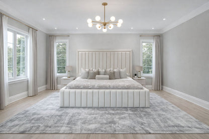 upholstered bed with vertical channelling and neutral fabric finish